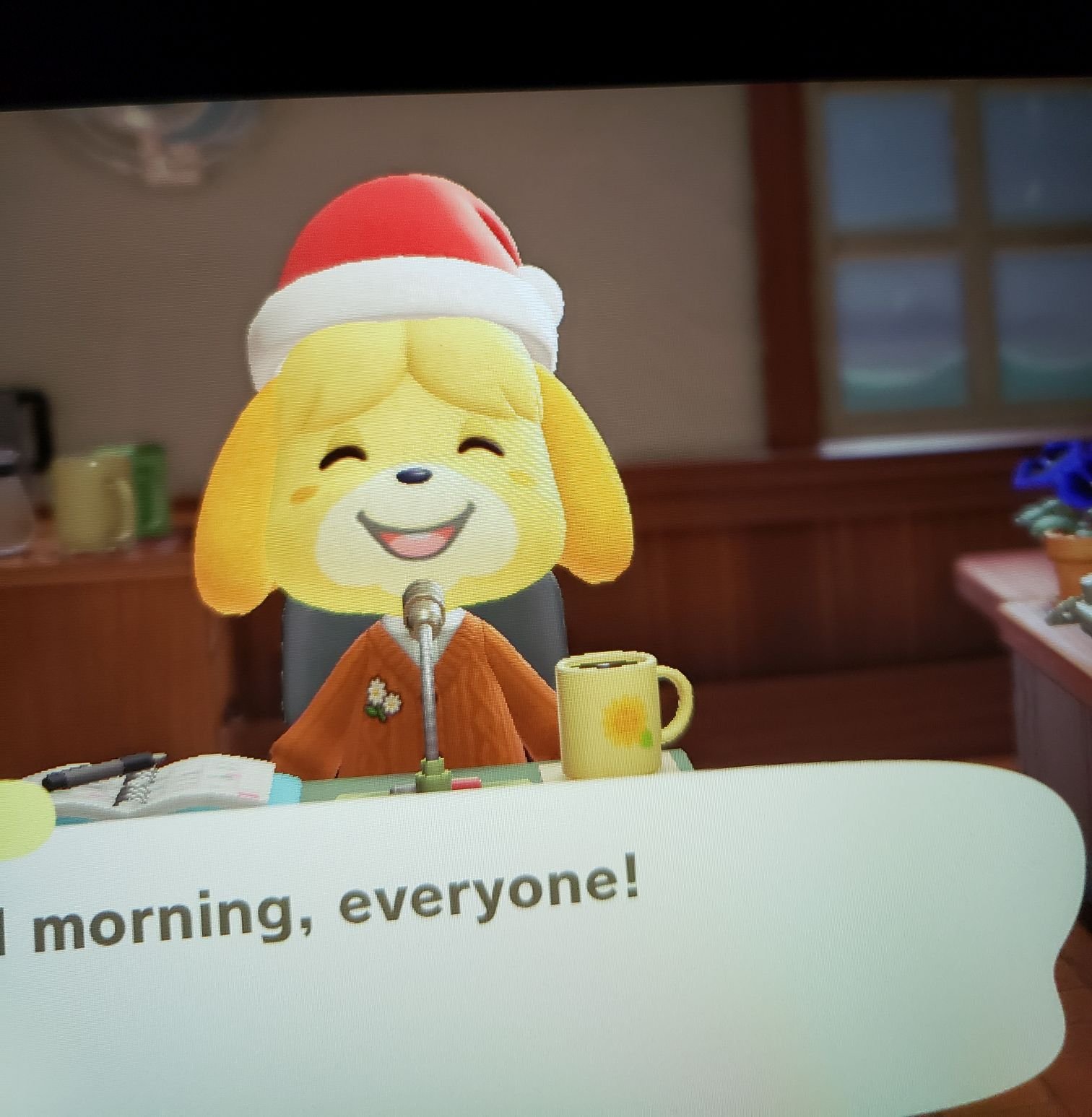 Animal Crossing New Horizon's Isabelle wearing a Toy Day hat