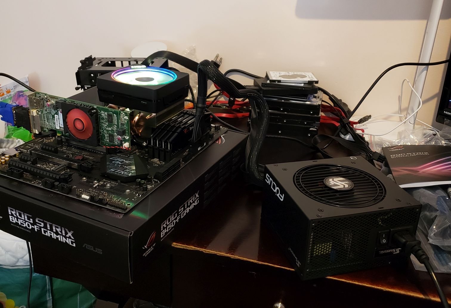 Computer components sitting on top of the motherboard box running